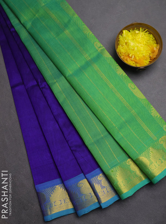 Silk cotton saree royal blue and teal green with plain body and paisley & temple zari woven border