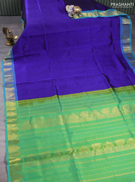 Silk cotton saree royal blue and teal green with plain body and paisley & temple zari woven border