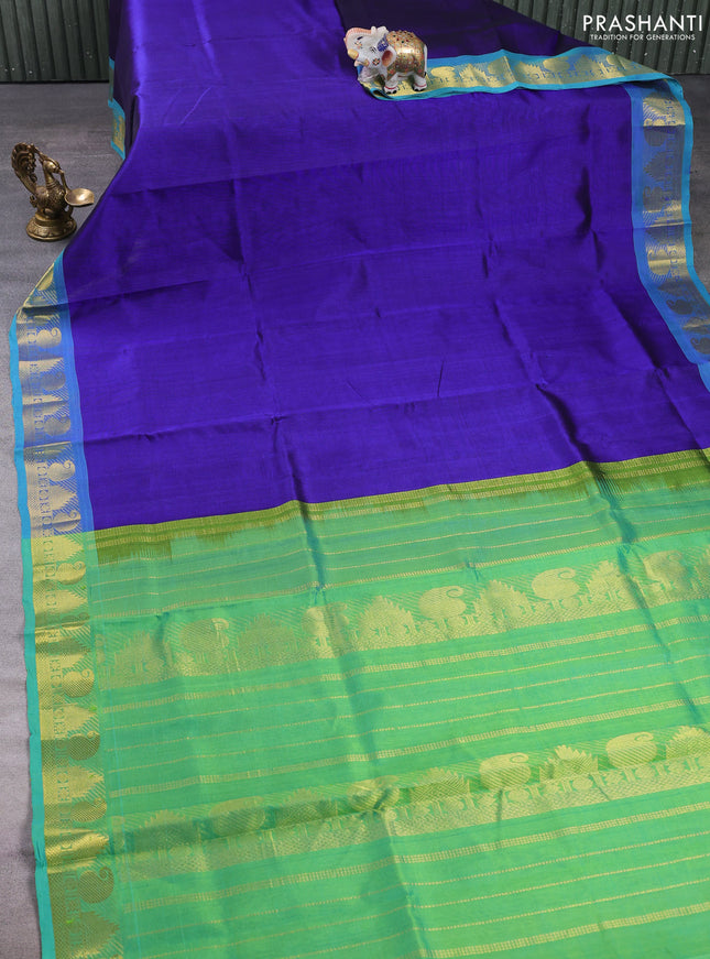 Silk cotton saree royal blue and teal green with plain body and paisley & temple zari woven border