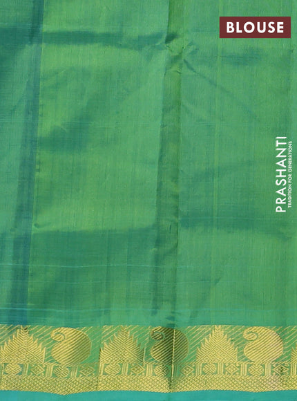Silk cotton saree royal blue and teal green with plain body and paisley & temple zari woven border