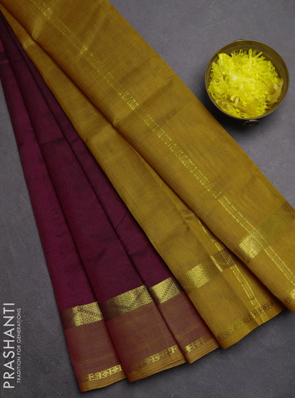 Silk cotton saree deep wine shade and dark mustard with plain body and rettapet zari woven border