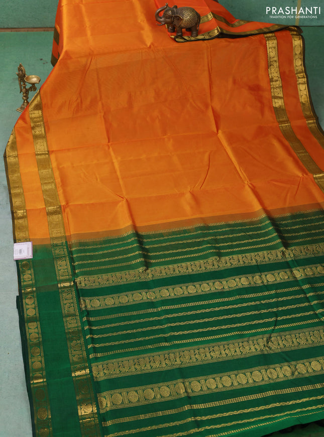 Silk cotton saree sunset orange and green with plain body and rettapet zari woven border