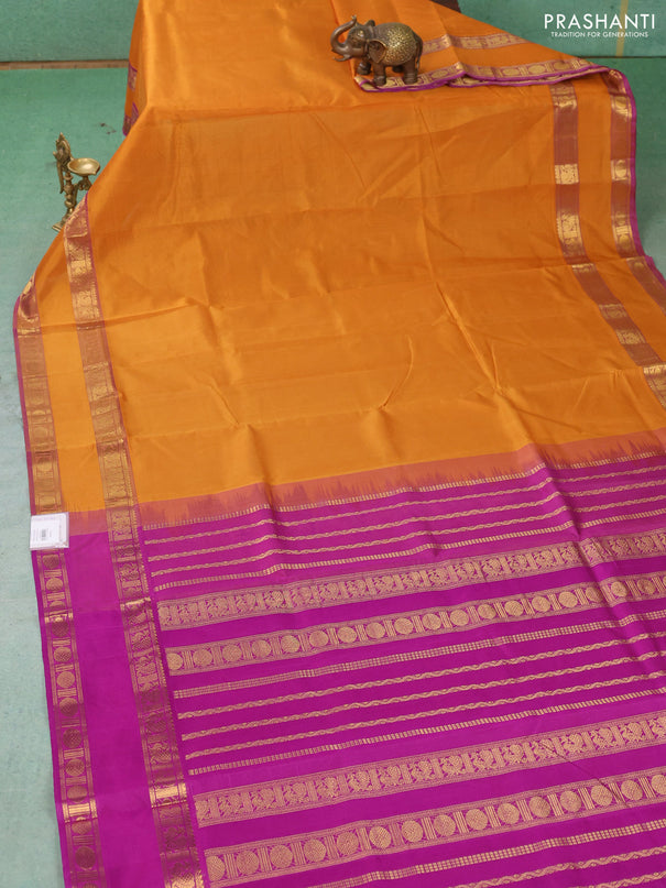 Silk cotton saree dark mustard and purple with plain body and rettapet zari woven border