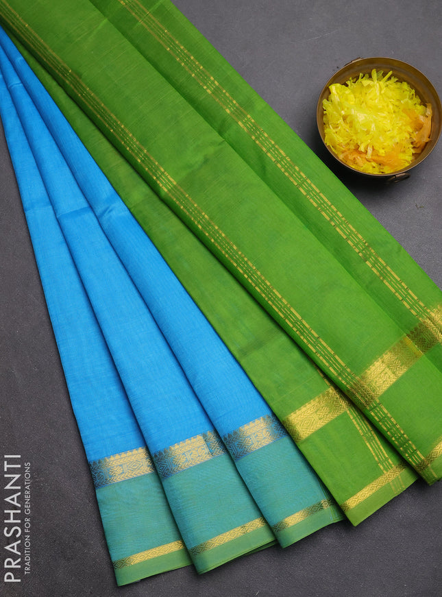 Silk cotton saree cs blue and light green with plain body and rettapet zari woven border
