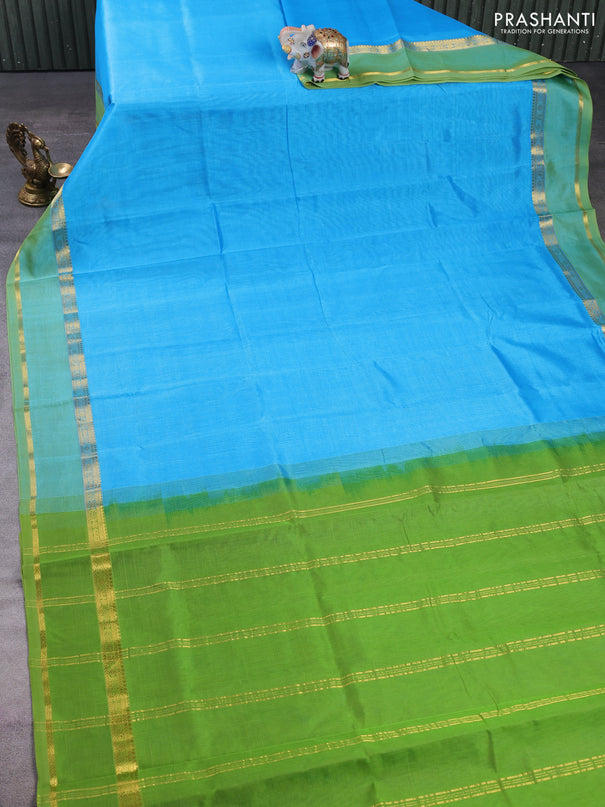 Silk cotton saree cs blue and light green with plain body and rettapet zari woven border