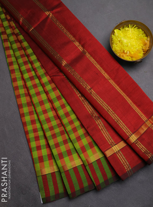 Silk cotton saree light green and maroon with allover paalum pazhamum checked pattern and zari woven simple border