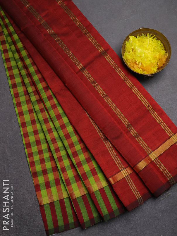 Silk cotton saree light green and maroon with allover paalum pazhamum checked pattern and zari woven simple border