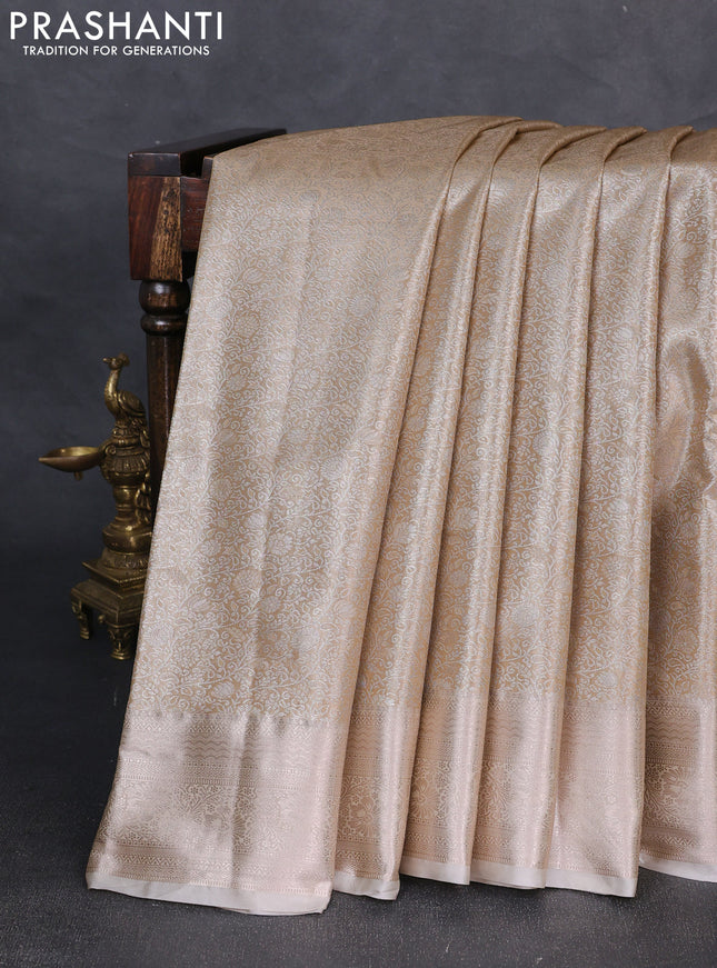 Bangalori tissue silk saree cream with allover zari woven brocade weaves and zari woven border