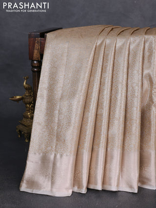 Bangalori tissue silk saree cream with allover zari woven brocade weaves and zari woven border