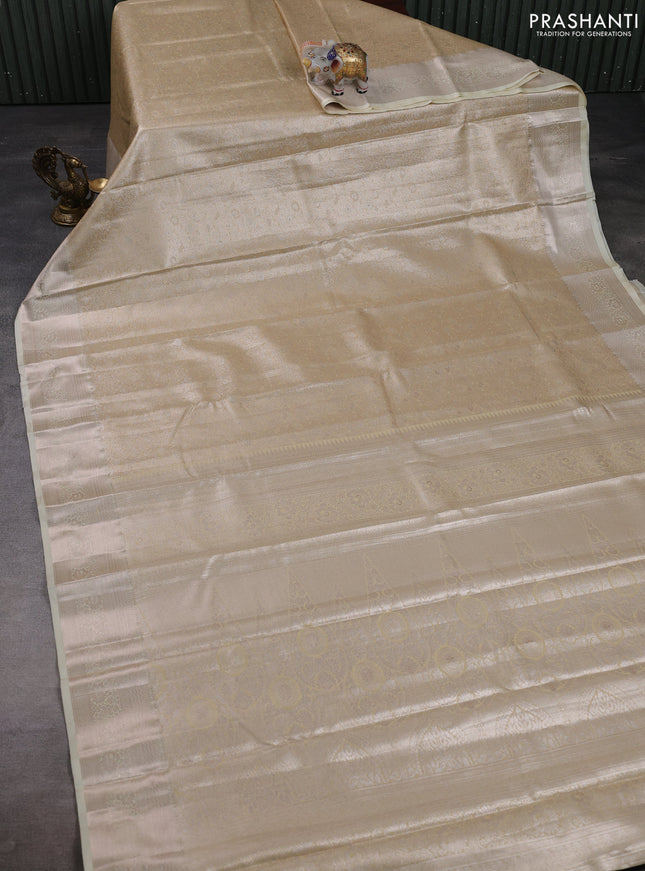 Bangalori tissue silk saree cream with allover zari woven brocade weaves and zari woven border