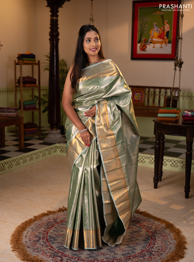 Bangalori tissue silk saree teal green with allover zari woven brocade weaves and zari woven border