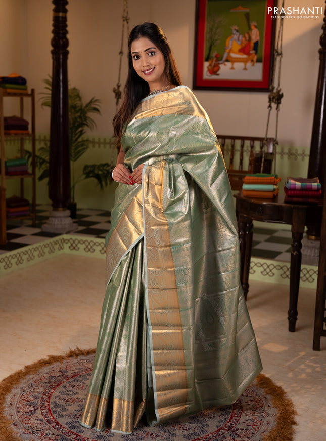 Bangalori tissue silk saree teal green with allover zari woven brocade weaves and zari woven border
