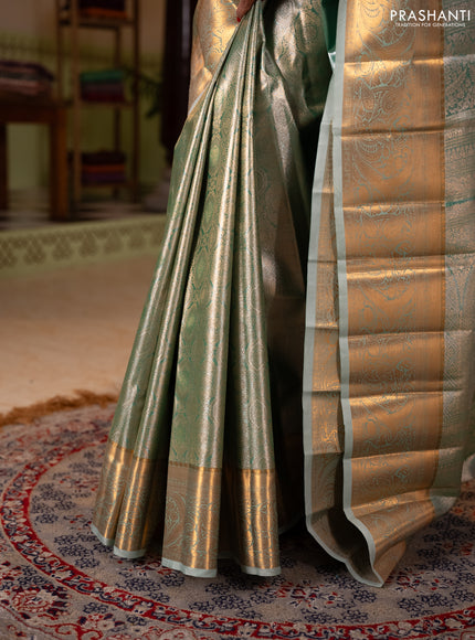 Bangalori tissue silk saree teal green with allover zari woven brocade weaves and zari woven border
