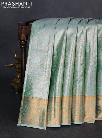 Bangalori tissue silk saree teal green with allover zari woven brocade weaves and zari woven border