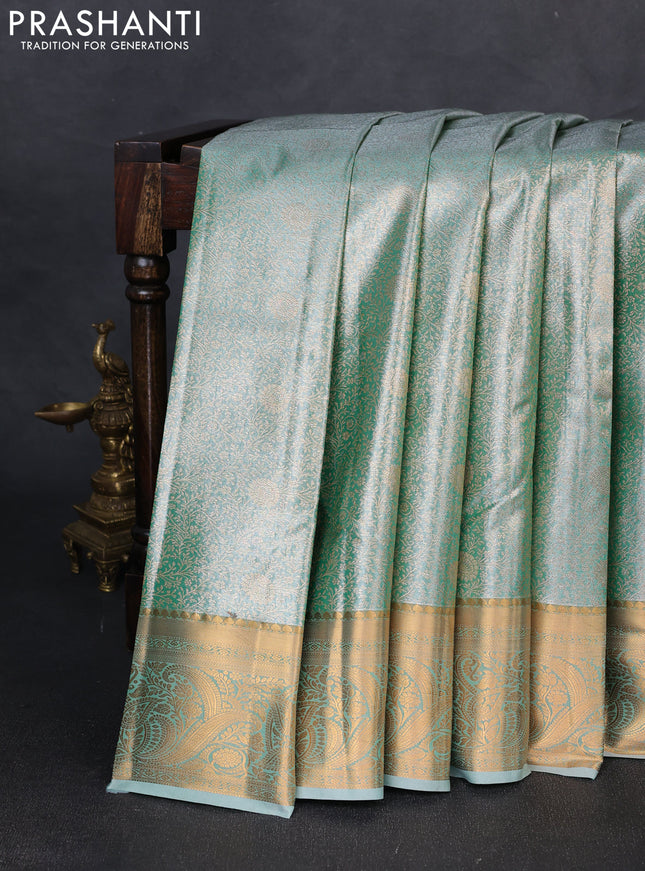Bangalori tissue silk saree teal green with allover zari woven brocade weaves and zari woven border