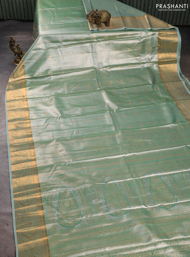 Bangalori tissue silk saree teal green with allover zari woven brocade weaves and zari woven border