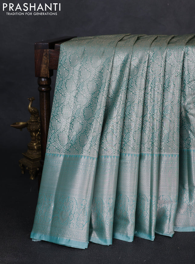 Bangalori tissue silk saree teal green shade with allover zari woven brocade weaves and long zari woven border