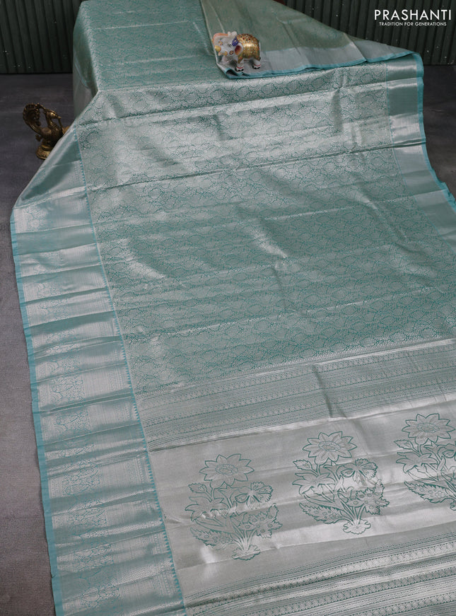 Bangalori tissue silk saree teal green shade with allover zari woven brocade weaves and long zari woven border