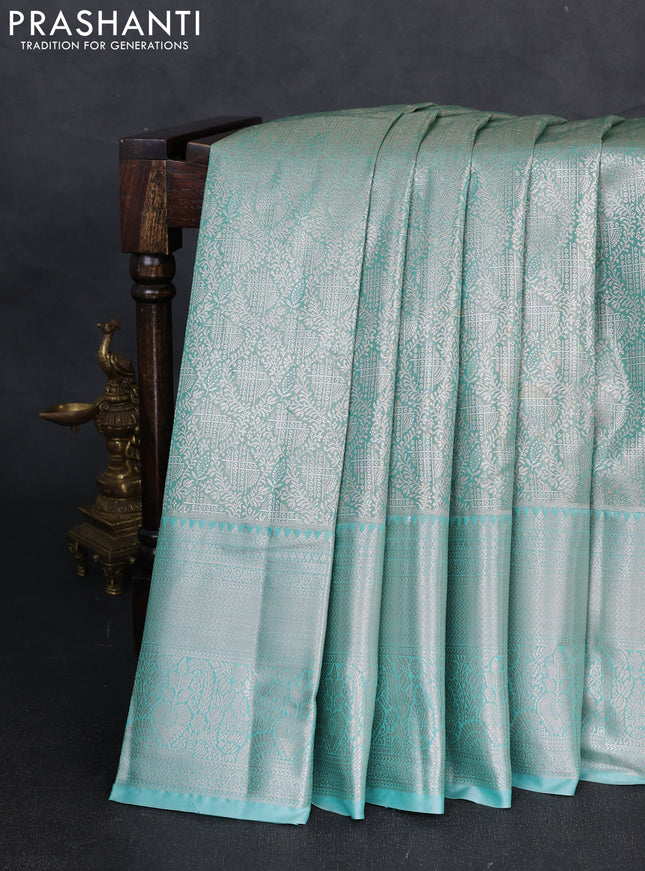 Bangalori tissue silk saree teal green with allover zari woven brocade weaves and zari woven border