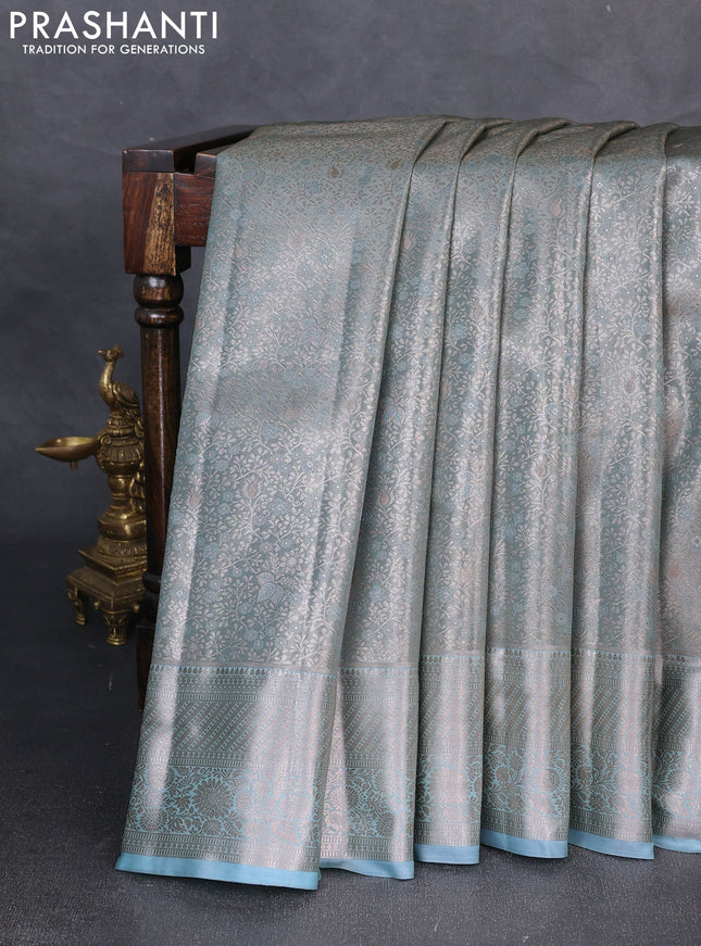 Bangalori tissue silk saree teal blue with allover zari woven brocade weaves and zari woven border