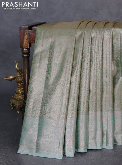 Bangalori tissue silk saree teal green with allover zari woven brocade weaves and zari woven border