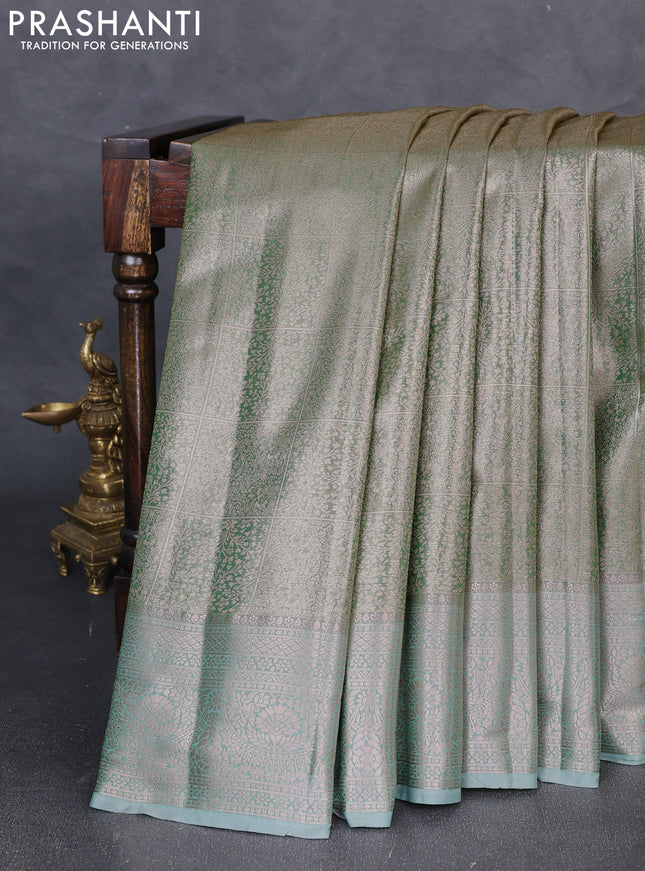 Bangalori tissue silk saree teal green with allover zari woven brocade weaves and zari woven border