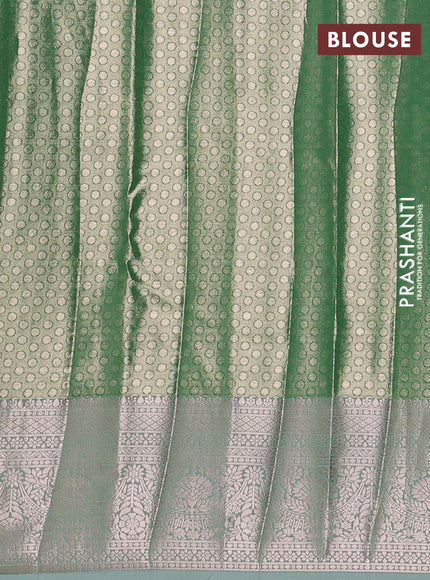 Bangalori tissue silk saree teal green with allover zari woven brocade weaves and zari woven border
