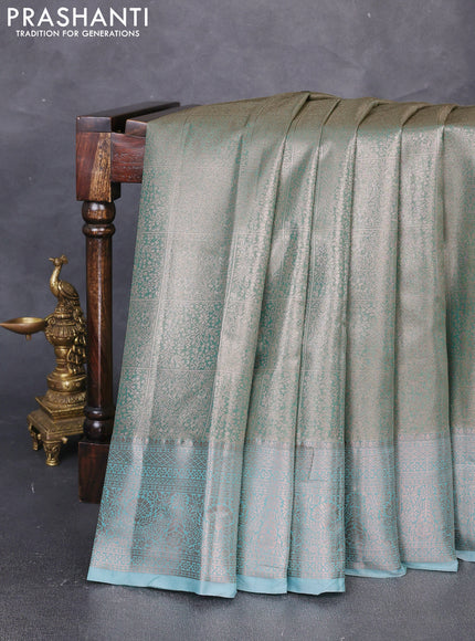 Bangalori tissue silk saree teal green with allover zari woven brocade weaves and zari woven border