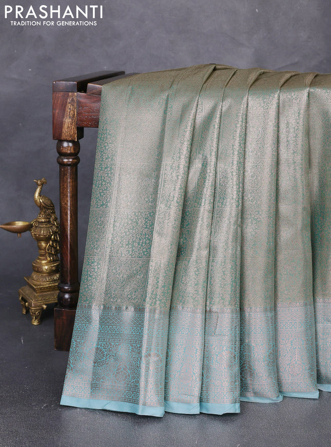 Bangalori tissue silk saree teal green with allover zari woven brocade weaves and zari woven border