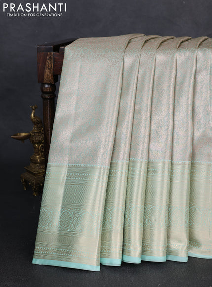 Bangalori tissue silk saree teal green with allover zari woven brocade weaves and long zari woven border
