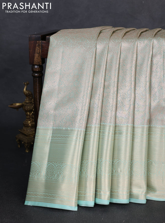 Bangalori tissue silk saree teal green with allover zari woven brocade weaves and long zari woven border