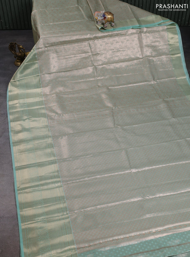 Bangalori tissue silk saree teal green with allover zari woven brocade weaves and long zari woven border