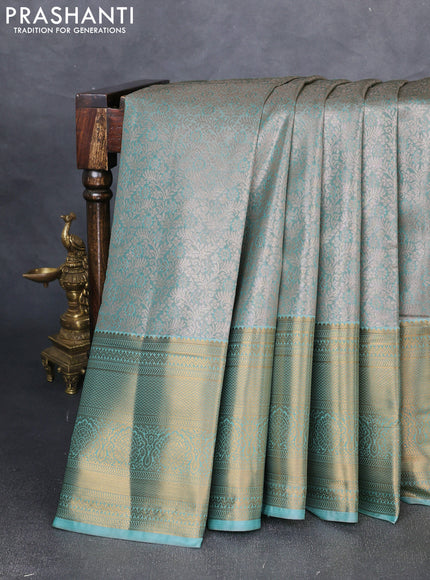 Bangalori tissue silk saree teal green with allover zari woven brocade weaves and long zari woven border