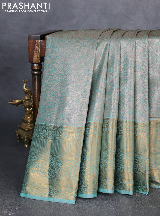 Bangalori tissue silk saree teal green with allover zari woven brocade weaves and long zari woven border