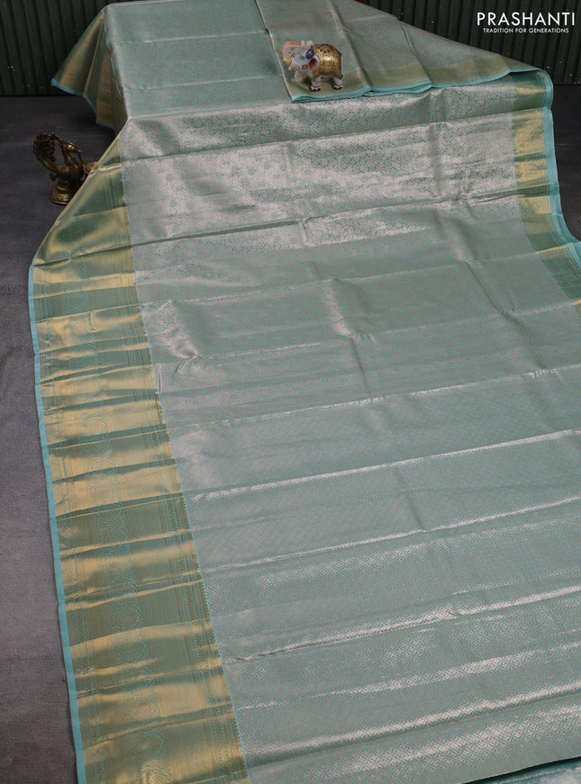 Bangalori tissue silk saree teal green with allover zari woven brocade weaves and long zari woven border