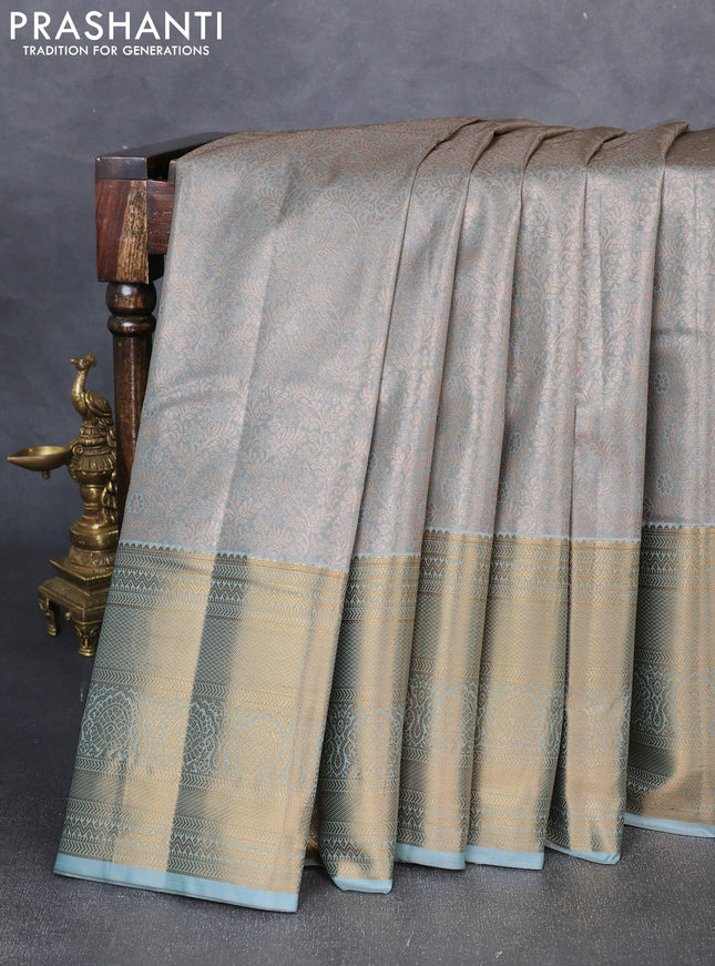 Bangalori tissue silk saree teal blue with allover zari woven brocade weaves and long zari woven border