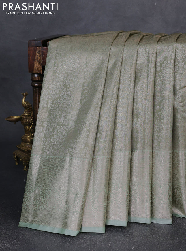 Bangalori tissue silk saree teal blue with allover zari woven brocade weaves and zari woven border