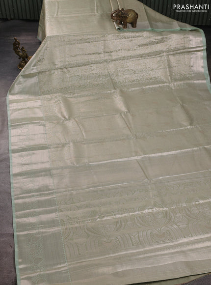 Bangalori tissue silk saree teal blue with allover zari woven brocade weaves and zari woven border