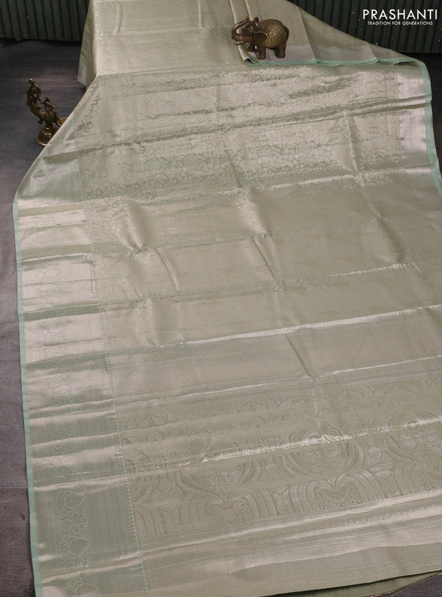 Bangalori tissue silk saree teal blue with allover zari woven brocade weaves and zari woven border