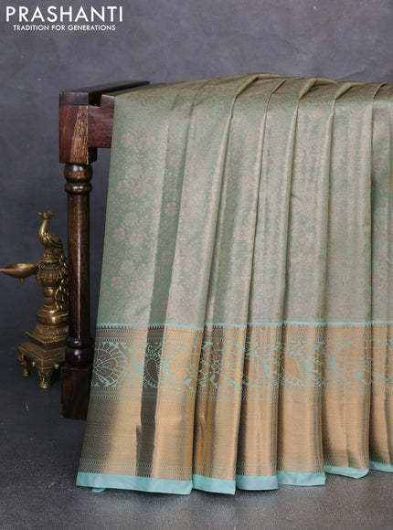 Bangalori tissue silk saree teal green with allover zari woven brocade weaves and long zari woven border