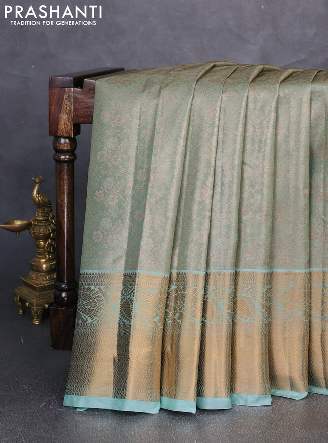 Bangalori tissue silk saree teal green with allover zari woven brocade weaves and long zari woven border
