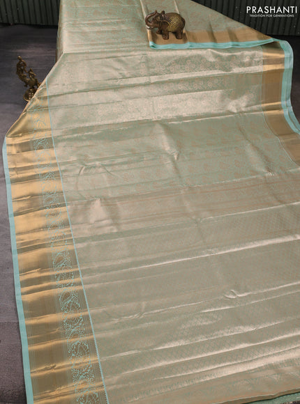 Bangalori tissue silk saree teal green with allover zari woven brocade weaves and long zari woven border