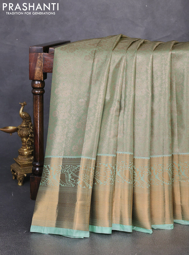 Bangalori tissue silk saree teal green with allover zari woven brocade weaves and long zari woven border