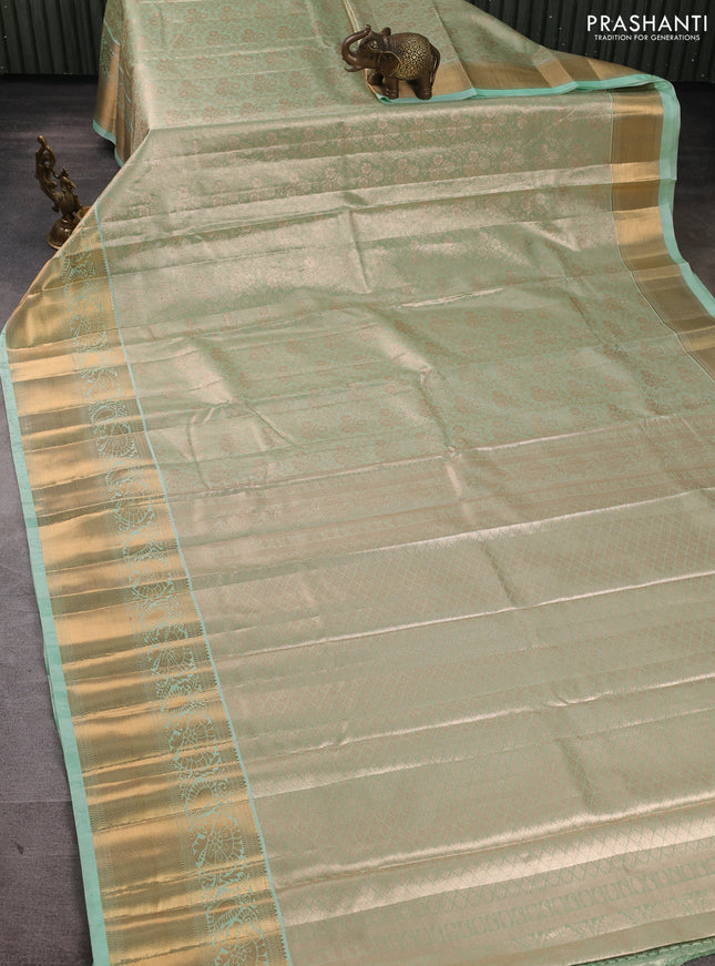 Bangalori tissue silk saree teal green with allover zari woven brocade weaves and long zari woven border