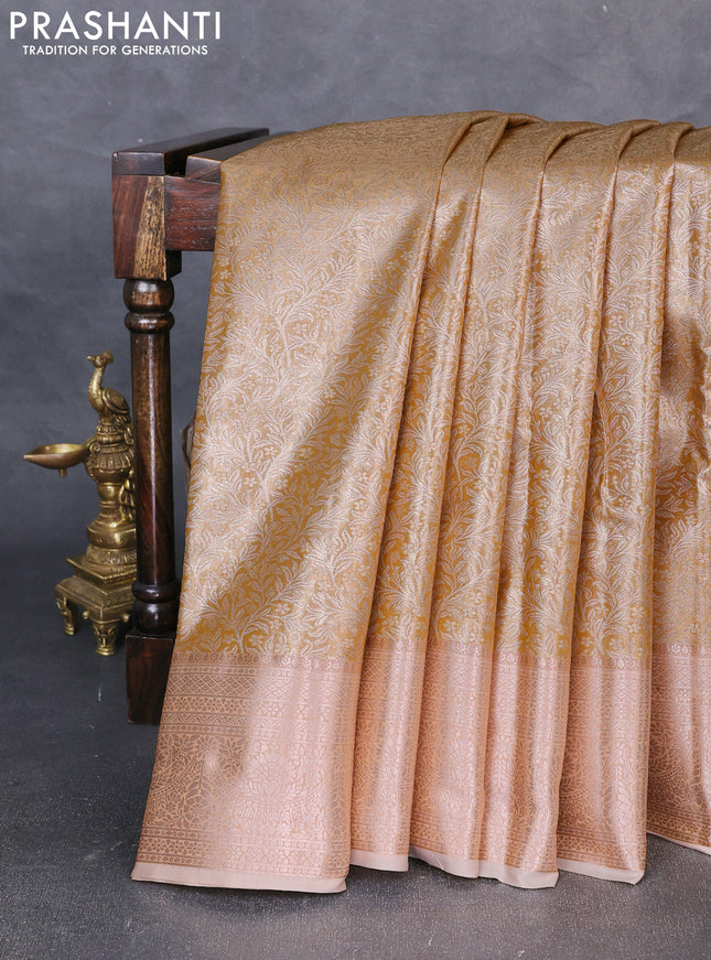 Bangalori tissue silk saree mustard yellow and pale orange with allover zari woven brocade weaves and zari woven border