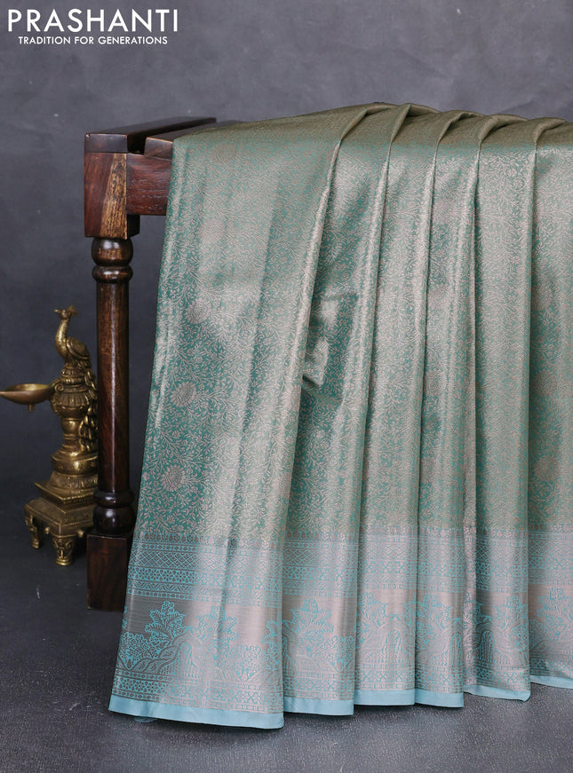Bangalori tissue silk saree teal blue with allover zari woven brocade weaves and zari woven border