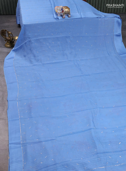 Pure chiffon silk saree pastel blue with golden buttas and floral printed blouse