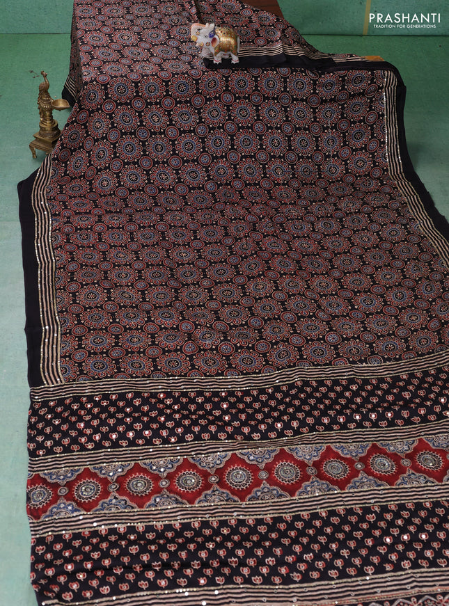 Modal silk saree black with allover ajrakh prints & sequin work and mirror sequin work pallu