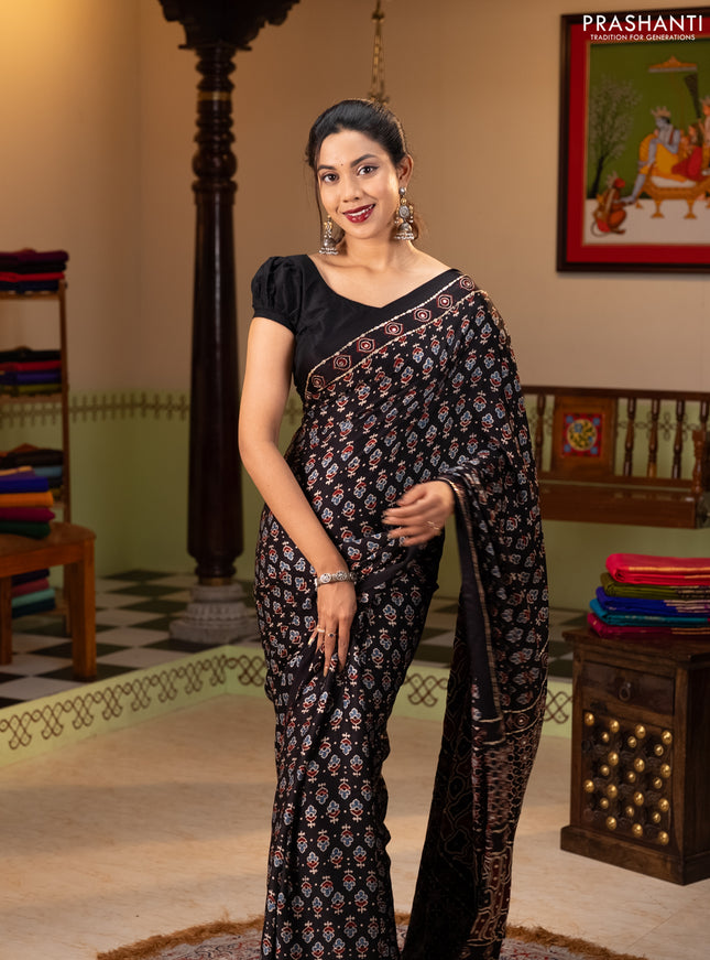 Modal silk saree black with allover ajrakh prints & sequin work and mirror sequin work pallu