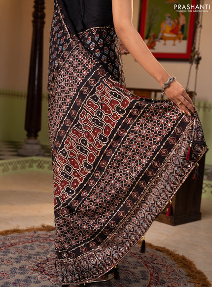 Modal silk saree black with allover ajrakh prints & sequin work and mirror sequin work pallu